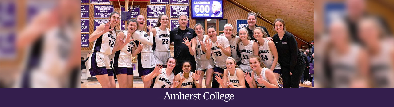 Coach G.P. Gromacki and the СCollege women's basketball team celebrate a win.